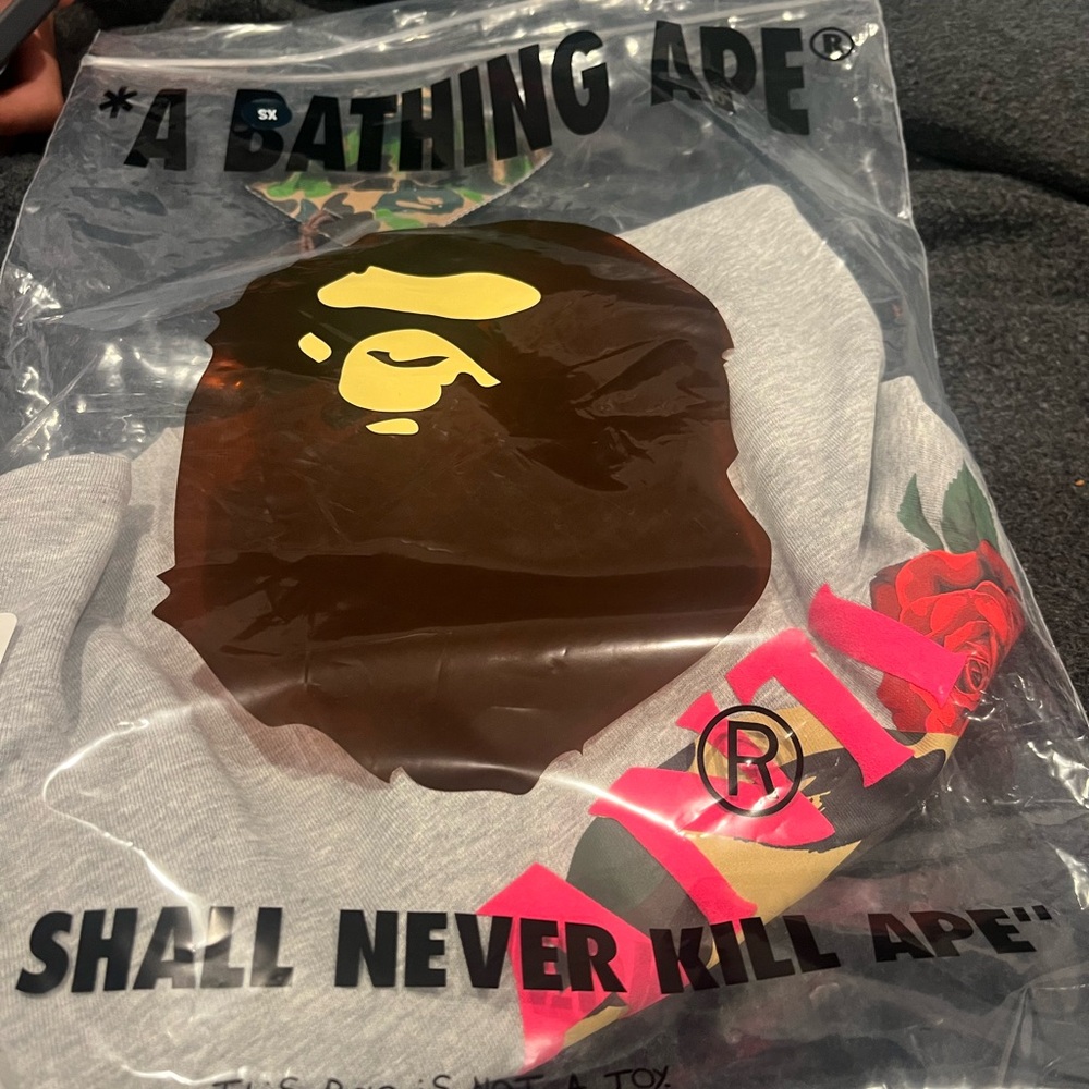 A Bathing Ape Gray Graphic T Shirt. A collab between Bape and Anti social.